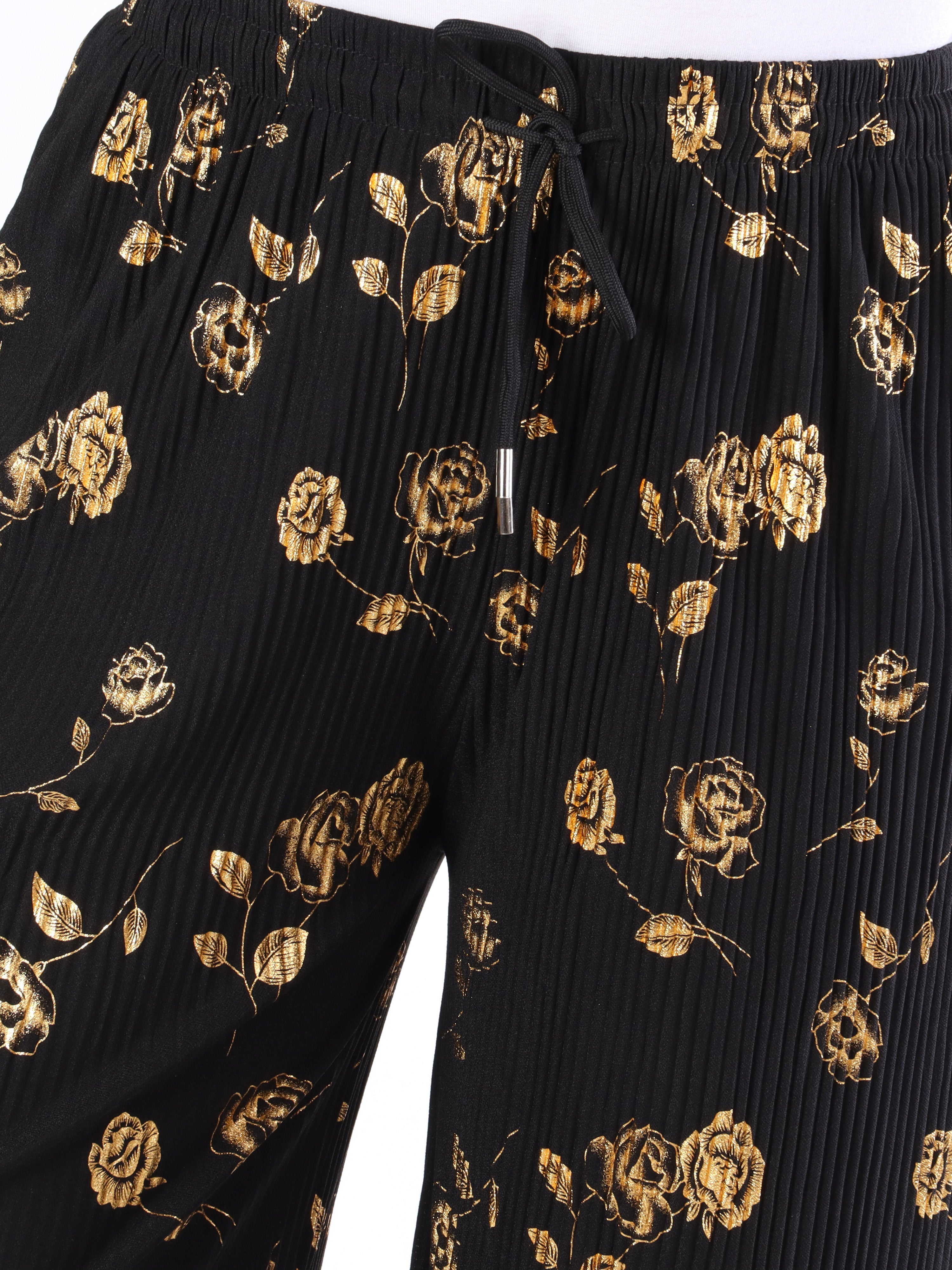 Alpha - Plisserade byxor med guldblommor